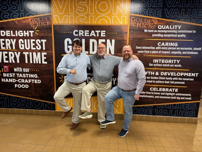 Mark Parmerlee (center) with his sons, including Michael (left)