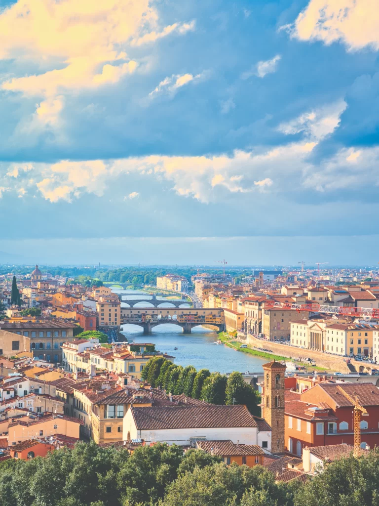 A vibrant, large-scale mural on an outdoor wall in Mexico City featuring stylized figures and bold colors in the tradition of Mexican muralism.