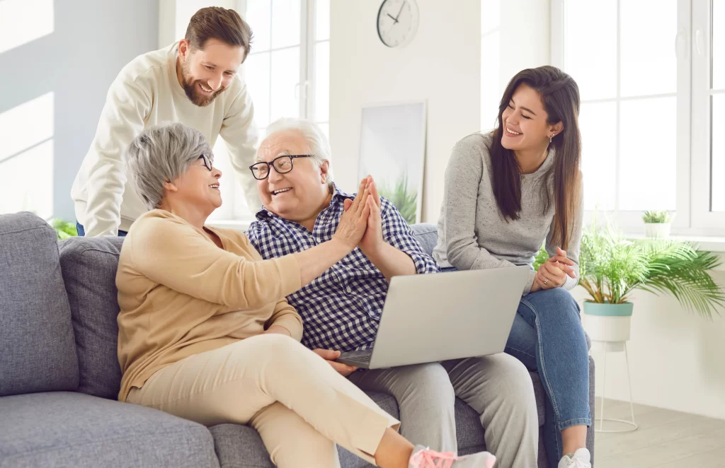 Older adult and family member sharing a close conversation while seated together at home.